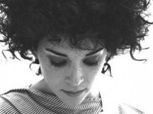 the-perils-of-divorced-pauline-women_wild_wavy_curly_hairstyle_with_bangs-300x224.jpg