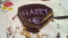 People or things: what makes you happy? A cake in the plate is inscribed with word happy.