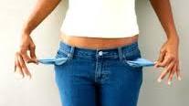 woman in blue jeans holding empty pockets out