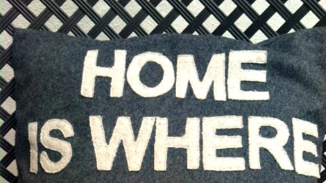 Picture of a cushion inscribed with home sweet home