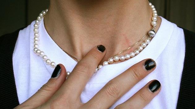 Woman Upset Hands Pearls.jpg