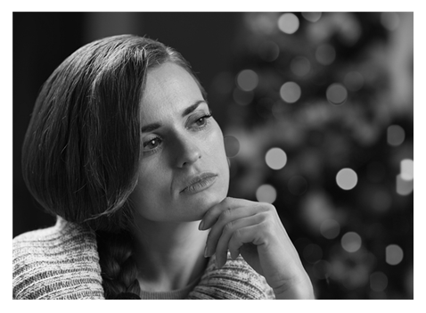 Pensive woman at Christmas bw.png
