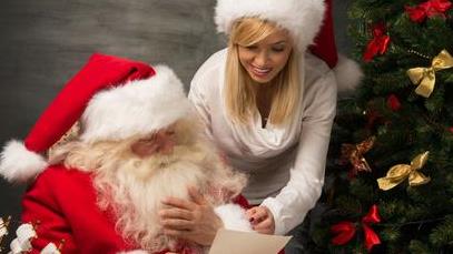 Picture of a woman with someone in Santa's costume