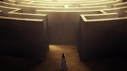 a woman in front of a maze