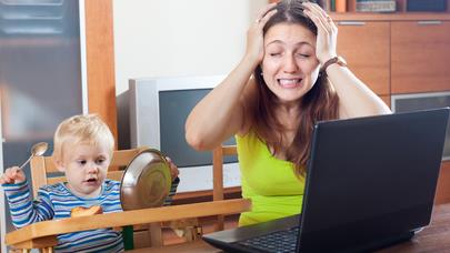 a woman going crazy between a baby and a computer