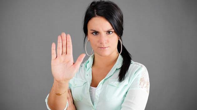 I'm not the crazy one: Woman with hand saying no