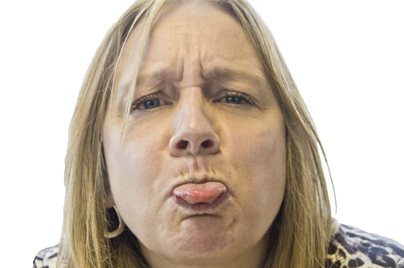 get even after divorce: angry woman sticking her tongue out