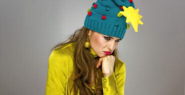 sad woman with a christmas tree hat one