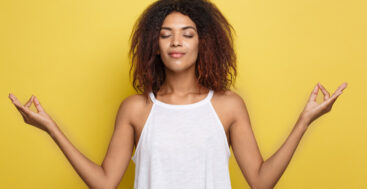 calm, relaxed african american woman meditating