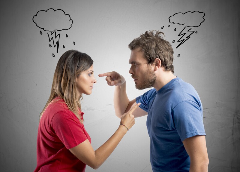 man and woman facing each other arguing