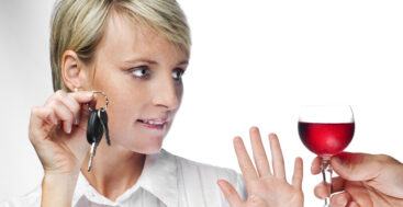 woman holding car keys and saying no to a drink