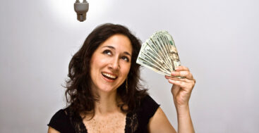 happy woman looking at her money